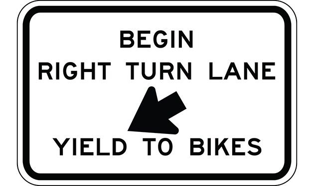 Begin Right Turn Lane, Yield to Bikes with Down Arrow Sign - - The